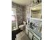 Bathroom with wallpaper, toilet, and sink at 300 Broadview Ave, Altamonte Springs, FL 32701