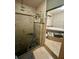 Bathroom features standup shower, bath, and neutral tile at 300 Broadview Ave, Altamonte Springs, FL 32701