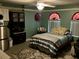 Bedroom with accent wall, area rug and queen bed at 300 Broadview Ave, Altamonte Springs, FL 32701