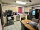 View of kitchen with stainless steel appliances and kitchen table at 300 Broadview Ave, Altamonte Springs, FL 32701