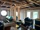 Spacious living room with exposed ceiling, cinder block walls and natural light from door and window at 300 Broadview Ave, Altamonte Springs, FL 32701