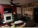 View of living area including fireplace, fan, television, and shelving at 300 Broadview Ave, Altamonte Springs, FL 32701