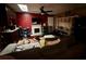 View of living area including fireplace, fan, television, and shelving at 300 Broadview Ave, Altamonte Springs, FL 32701