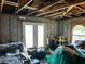 Unfinished room in need of repair with boxes and furniture at 300 Broadview Ave, Altamonte Springs, FL 32701