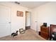 Bedroom with carpet and a closet, with a window with white blinds, and a wood dresser and bookshelf at 35734 Rose Moss Ave, Leesburg, FL 34788