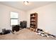 Bedroom with carpet and toys, and a window with white blinds, and a wood dresser and bookshelf at 35734 Rose Moss Ave, Leesburg, FL 34788