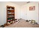 Bedroom with carpet and toys, and a bookshelf, and a window with white blinds, and a wood dresser at 35734 Rose Moss Ave, Leesburg, FL 34788