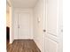 Bright entryway features wood-look flooring, with a front door and access to other rooms at 35734 Rose Moss Ave, Leesburg, FL 34788