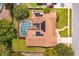 Aerial view of a single Gathering home with a screened-in pool and solar panels at 413 Sandy Hill Dr, Longwood, FL 32779