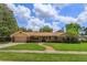 Charming single-story home featuring a well-manicured lawn and inviting front entrance at 413 Sandy Hill Dr, Longwood, FL 32779