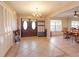 Inviting foyer with tile flooring, chandelier, and decorative accents at 413 Sandy Hill Dr, Longwood, FL 32779