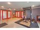 Bright home gym offering various workout equipment, red doors, and plenty of space at 413 Sandy Hill Dr, Longwood, FL 32779