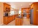 Spacious kitchen featuring granite countertops, stainless steel appliances and wooden cabinetry at 413 Sandy Hill Dr, Longwood, FL 32779