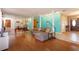 Open-concept living room with hardwood floors, modern decor, and ample space at 413 Sandy Hill Dr, Longwood, FL 32779