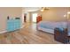 Spacious bedroom with wood-look tile flooring, ceiling fan, and ample natural light at 413 Sandy Hill Dr, Longwood, FL 32779