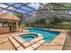 Stunning pool with attached hot tub, and screened-in enclosure for year-round enjoyment at 413 Sandy Hill Dr, Longwood, FL 32779