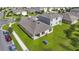 Aerial view of a home with a well-maintained backyard and neighborhood setting, showcasing its curb appeal at 415 Anne St, Deland, FL 32724