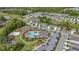 Aerial view displaying community amenities, including a pool, playground, and ample green spaces for recreation at 415 Anne St, Deland, FL 32724