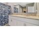 Bathroom featuring double sinks, granite countertops, and a decorative shower curtain for a stylish look at 415 Anne St, Deland, FL 32724
