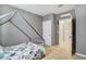 Cozy bedroom featuring gray walls, neutral carpet, and a unique bed frame at 415 Anne St, Deland, FL 32724