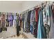 Walk-in closet with ample hanging space and organized clothing racks for convenient storage solutions at 415 Anne St, Deland, FL 32724