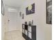 Inviting entryway with light tile flooring, a front door, and stylish decorations at 415 Anne St, Deland, FL 32724