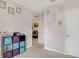 Hallway with gray walls, neutral carpet, and decorative storage, leading to other rooms in the house at 415 Anne St, Deland, FL 32724