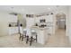Stylish kitchen featuring granite countertops, stainless steel appliances, and white cabinetry at 415 Anne St, Deland, FL 32724