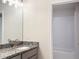 Bathroom with one sink, granite countertop, modern lighting, and a view of the shower and toilet at 4185 Sagefield Dr, St Cloud, FL 34773