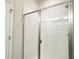 Bathroom with sliding glass shower door and white subway tile at 4185 Sagefield Dr, St Cloud, FL 34773