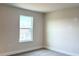 Bright bedroom featuring carpet floors, a window, and neutral paint at 4185 Sagefield Dr, St Cloud, FL 34773