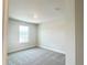 Bedroom featuring a window and neutral carpet at 4185 Sagefield Dr, St Cloud, FL 34773