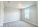 Bright bedroom with a large window, neutral carpet, and a spacious layout at 4185 Sagefield Dr, St Cloud, FL 34773