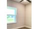Bedroom featuring neutral paint and carpet and a large picture window with a backyard view at 4185 Sagefield Dr, St Cloud, FL 34773