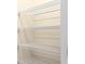 Walk-in closet featuring white wire shelving, providing ample storage space at 4185 Sagefield Dr, St Cloud, FL 34773