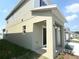 Exterior view of the home featuring a covered entrance and well-manicured landscaping at 4185 Sagefield Dr, St Cloud, FL 34773