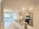 Modern kitchen features stainless steel appliances, granite countertops, and a center island with a sink at 4185 Sagefield Dr, St Cloud, FL 34773