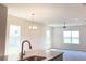 Bright, open-concept kitchen featuring granite countertops and stainless steel faucet at 4185 Sagefield Dr, St Cloud, FL 34773