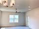 Bright living room with a ceiling fan, neutral paint, and a large window with a lake view at 4185 Sagefield Dr, St Cloud, FL 34773