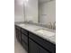 Bathroom features double sinks, granite countertops, and sleek modern fixtures at 4224 Sagefield Dr, Harmony, FL 34773