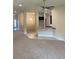 Open-concept space featuring living and kitchen areas with carpet and tile flooring at 4224 Sagefield Dr, Harmony, FL 34773