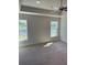 Bedroom featuring neutral carpet, a ceiling fan, and dual windows for natural light at 4224 Sagefield Dr, Harmony, FL 34773