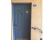 Blue apartment front door with metal hardware and a welcome mat at 495 Las Cortes Ln # 206, Orlando, FL 32824