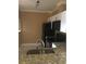 Kitchen showcasing a double sink, granite countertops, and white cabinets at 495 Las Cortes Ln # 206, Orlando, FL 32824