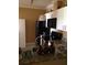 Kitchen featuring granite countertops, white cabinets, and black appliances at 495 Las Cortes Ln # 206, Orlando, FL 32824