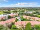 Aerial view showing community buildings, swimming pool, and water features at 5164 Conroy Rd # 1526, Orlando, FL 32811