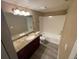 Standard bathroom with a shower-tub combo and a granite countertop vanity at 5164 Conroy Rd # 1526, Orlando, FL 32811