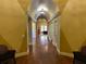 View of the long hallway with archways and doors to the units in the complex at 5164 Conroy Rd # 1526, Orlando, FL 32811