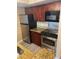 Updated kitchen with granite countertops and stainless steel appliances at 5164 Conroy Rd # 1526, Orlando, FL 32811