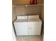 Dedicated laundry area with washer, dryer, and storage shelf at 5164 Conroy Rd # 1526, Orlando, FL 32811